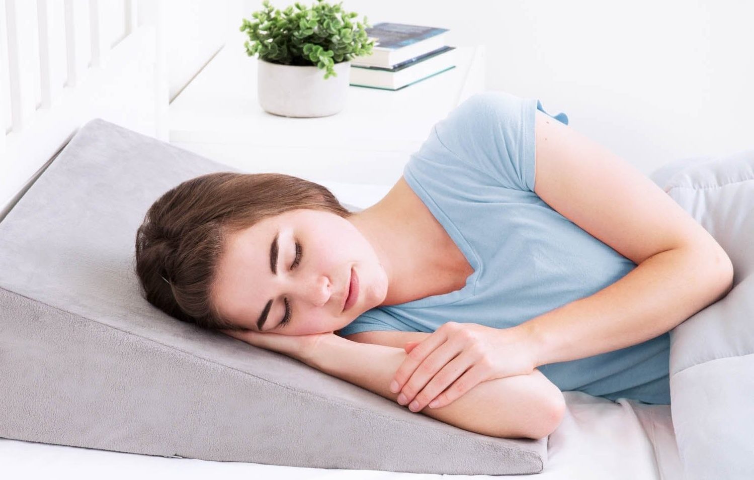 Christina sleeping on a pillow for apnea and snoring.